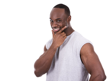 young fitness black man wearing light tshirt on white backgroundの写真素材