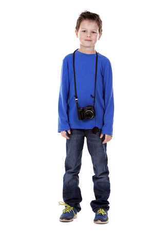 six years old boy taking photos with his camera on white backgroundの写真素材