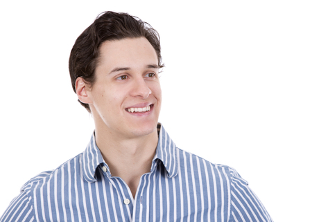 young caucasian man wearing blue shirt and black pants on white backgroundの写真素材