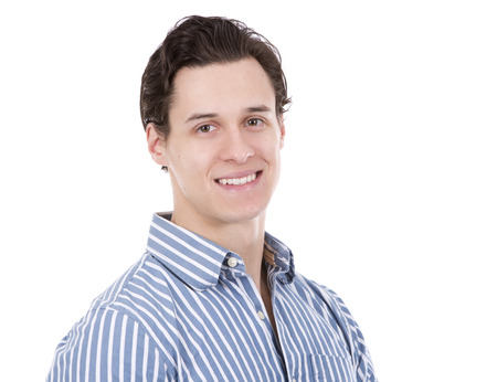 young caucasian man wearing blue shirt and black pants on white backgroundの写真素材