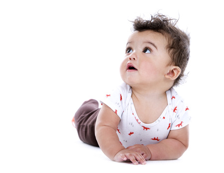 adorable baby boy wrapped with blanked on white background