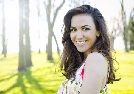 young brunette wearing summer outfit outdoorsの写真素材