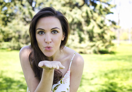 young brunette wearing summer outfit outdoorsの写真素材