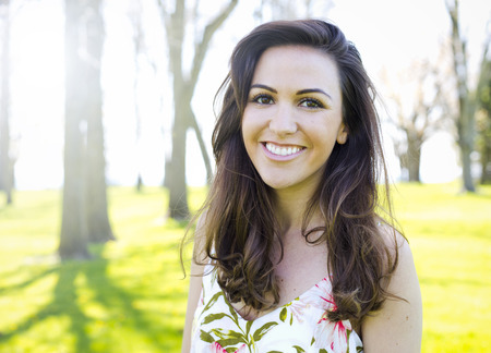 young brunette wearing summer outfit outdoorsの写真素材