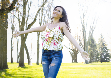 young brunette wearing summer outfit outdoors