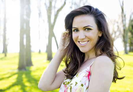 young brunette wearing summer outfit outdoorsの写真素材