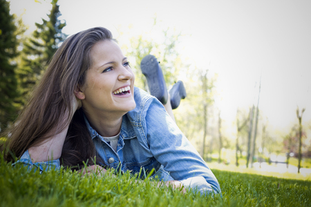 young brunette wearing summer outfit outdoorsの写真素材