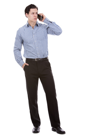 young caucasian man wearing blue shirt and black pants on white backgroundの写真素材