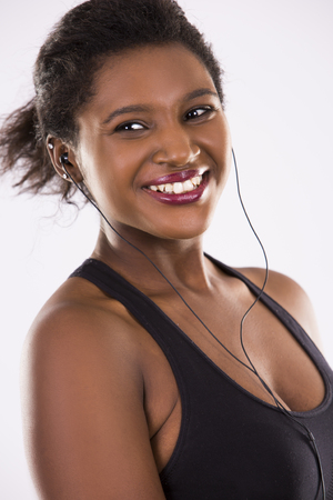 young black woman wearing fitness outfit on white isolated backgroundの写真素材