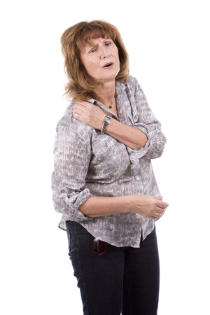 hurting older caucasian woman wearing casual outfit on white isolated backgroundの写真素材