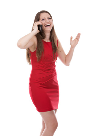 young caucasian woman using her mobile phone on white backgroundの写真素材