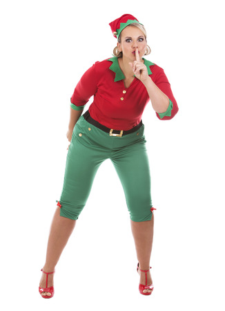 blonde woman wearing elf christmas costume on white backgroundの写真素材