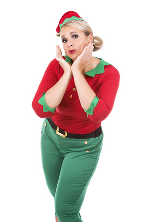 blonde woman wearing elf christmas costume on white backgroundの写真素材