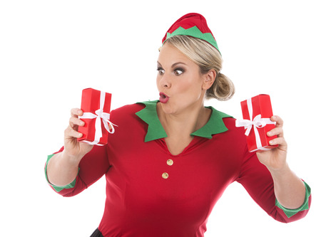 blonde woman wearing elf christmas costume on white backgroundの写真素材