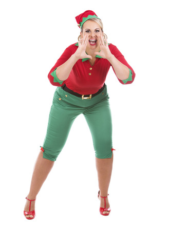 blonde woman wearing elf christmas costume on white backgroundの写真素材