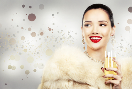 Upscale woman wearing gold jewellery and red lipstick. Red hearts. Light background.の写真素材