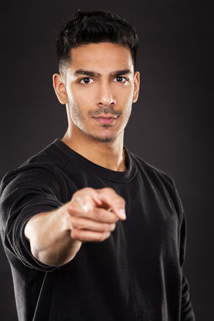 young fit indian man wearing dark workout outfitの写真素材
