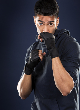young fit indian man wearing dark workout outfitの写真素材