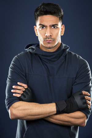 young fit indian man wearing dark workout outfitの写真素材