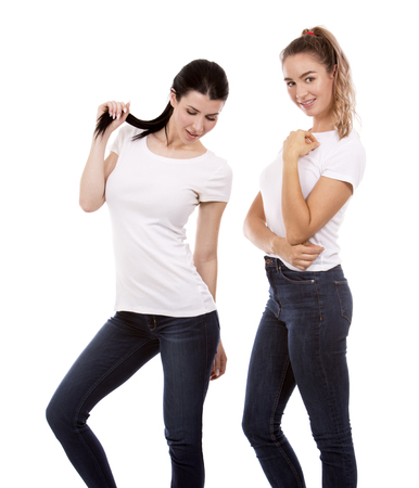 young casual caucasian women wearing white tshirt and blue jeans on white isolated backgroundの写真素材