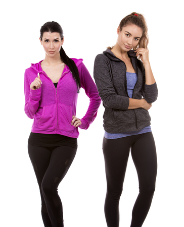 young casual caucasian women wearing sport outfits on white isolated background.の写真素材