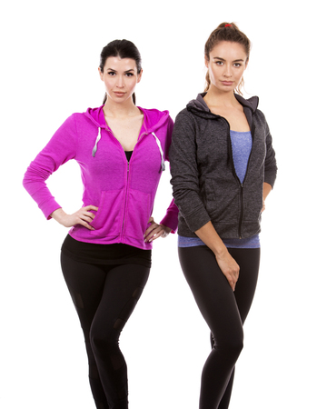 young casual caucasian women wearing sport outfits on white isolated background.の写真素材