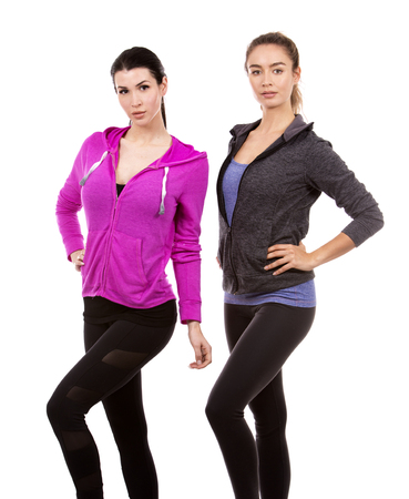 young casual caucasian women wearing sport outfits on white isolated background.の写真素材