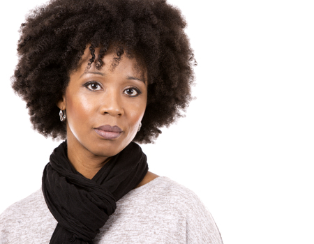 beautiful casual black woman wearing light top and black scarft on white isolated backgroundの写真素材