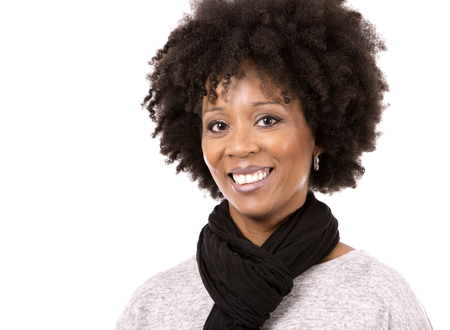 beautiful casual black woman wearing light top and black scarft on white isolated backgroundの写真素材