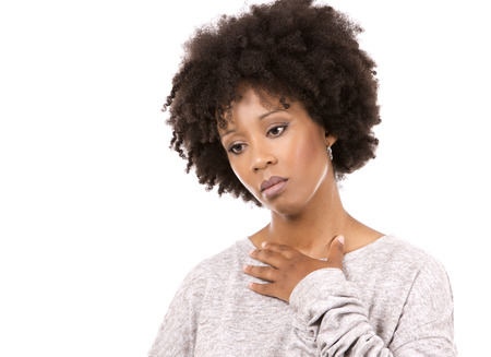 sadl casual black woman wearing light top on white isolated backgroundの写真素材