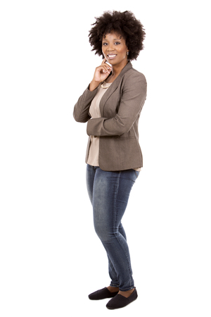 beautiful casual black woman wearing office wear on white isolated backgroundの写真素材