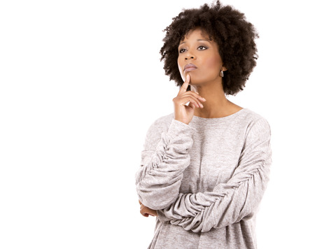 sadl casual black woman wearing light top on white isolated backgroundの写真素材