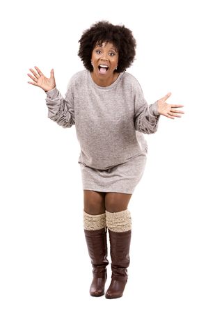 beautiful casual black woman wearing light top on white isolated backgroundの写真素材