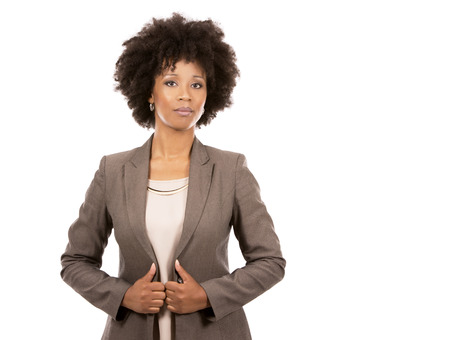 beautiful casual black woman wearing office wear on white isolated backgroundの写真素材