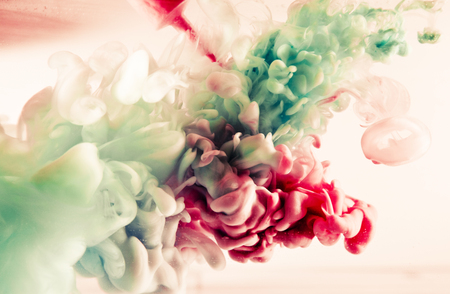 green and red splash on white background. It is a paint of splash in colorful view.の写真素材