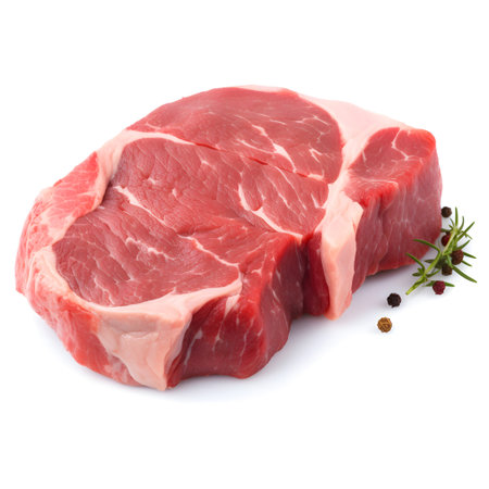 Raw beef steak isolated on white background cutout. Top view.の素材
