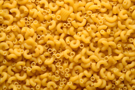 Raw macaroni background. Top view. Close-up.の素材