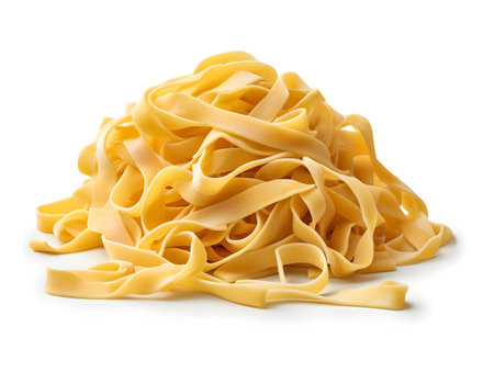 close up of a raw tagliatelle pasta on white backgroundの素材