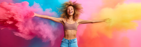 Portrait of a happy young woman in sportswear jumping on colorful backgroundの素材