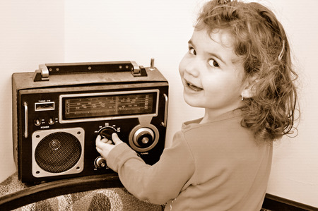 Sweet young girl and retro dusty radioの写真素材