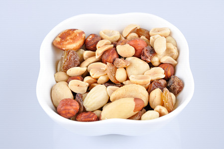 Mixed nuts in a white bowl