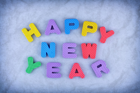 Happy New Year sign made out of alphabet isolated on icy backgroundの写真素材