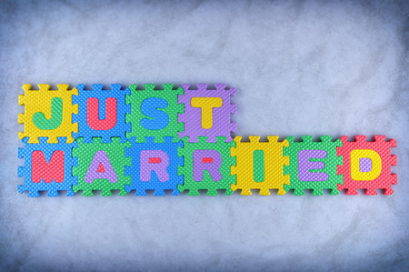 Just married sign made out of alphabet puzzle piecesの写真素材