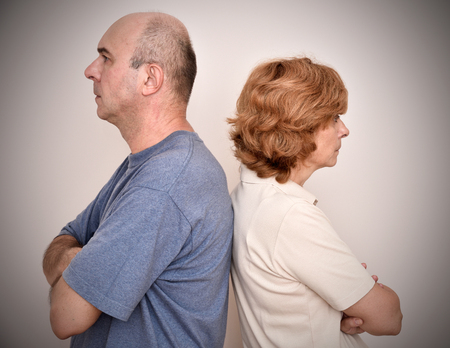Angry woman and man turning their backs to each other