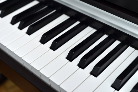 Piano keyboard with black and white keys. Closeup. Selective focus.の写真素材