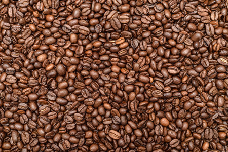 Heap of fresh roasted coffee beans on the table. Top view.の写真素材