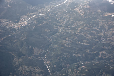Aerial view of the earth relief from the airplane window. Earth relief from aerial view. Abstract texture background.の写真素材
