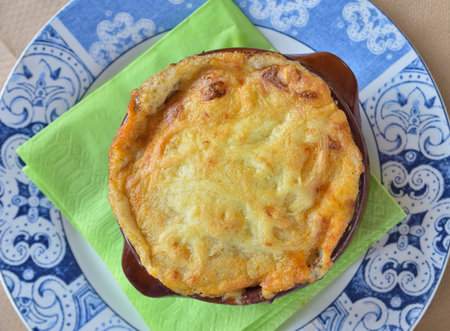Traditional Greek style moussaka prepared and served in clay pot. Top view.の写真素材