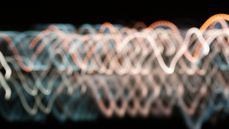 Abstract gentle background of colored lights trajectories shot with a small depth of fieldの写真素材
