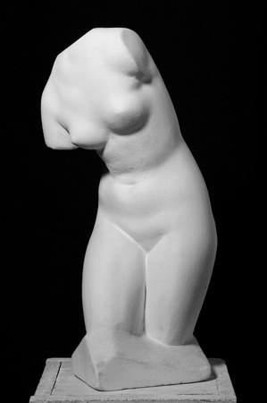 White gypseous woman's body, 	
back, isolated on black backgroundの写真素材